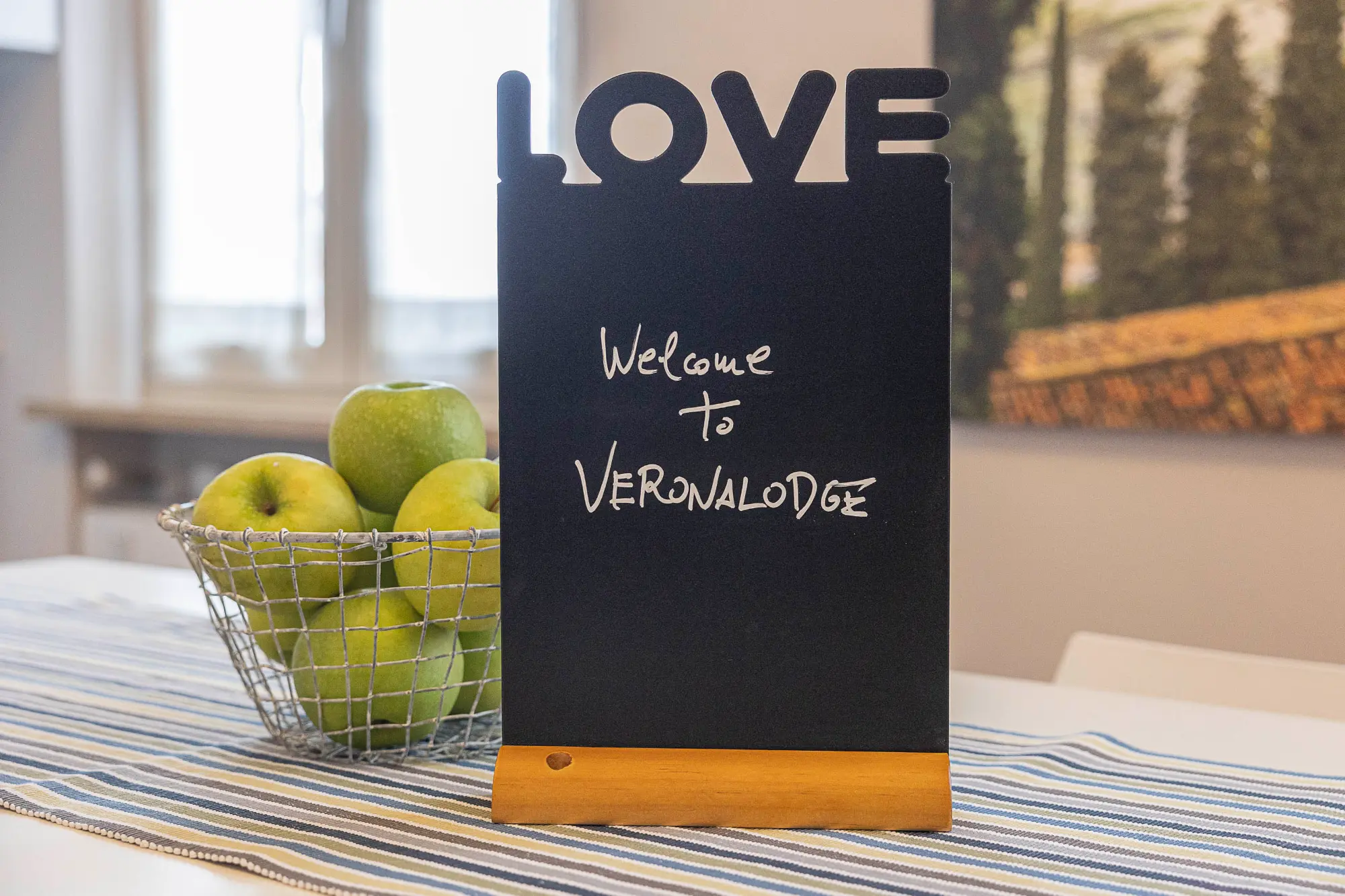 Welcome to VeronaLodge chalkboard sign in apartment in Verona